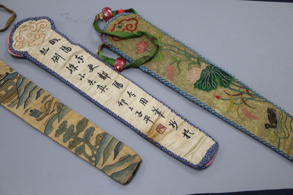 Three embroidered Chinese fan cases, one Kesi and woven with a tree, river and temple motifs, another with fine embroidered duck and li